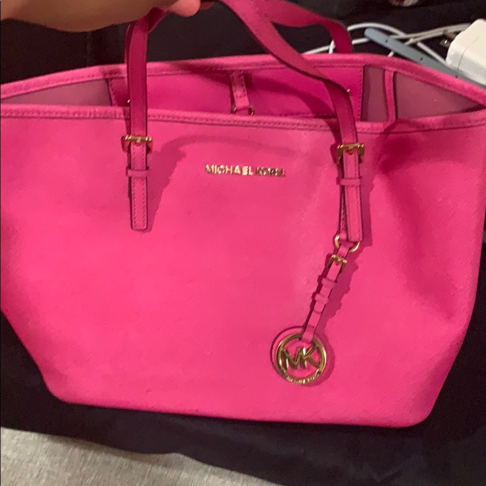 This is a small Michael Kors shoulder bag.